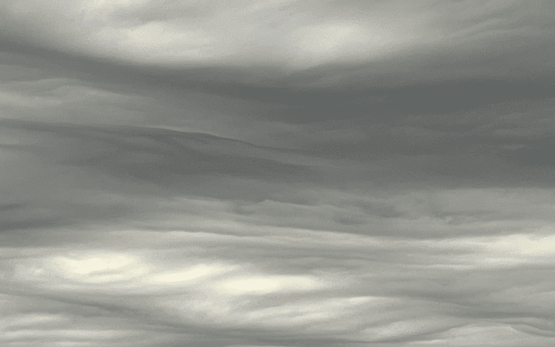 A photo of wavy grey clouds.